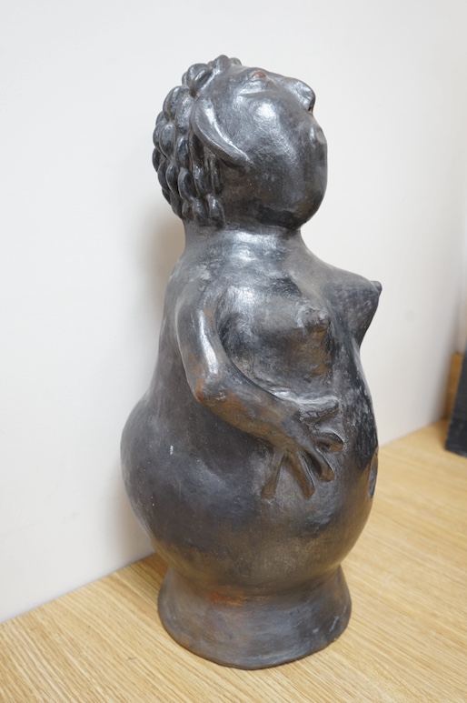 An African clay sculpture of a woman by Jesserina Chamisa, 52cm high. Condition - good